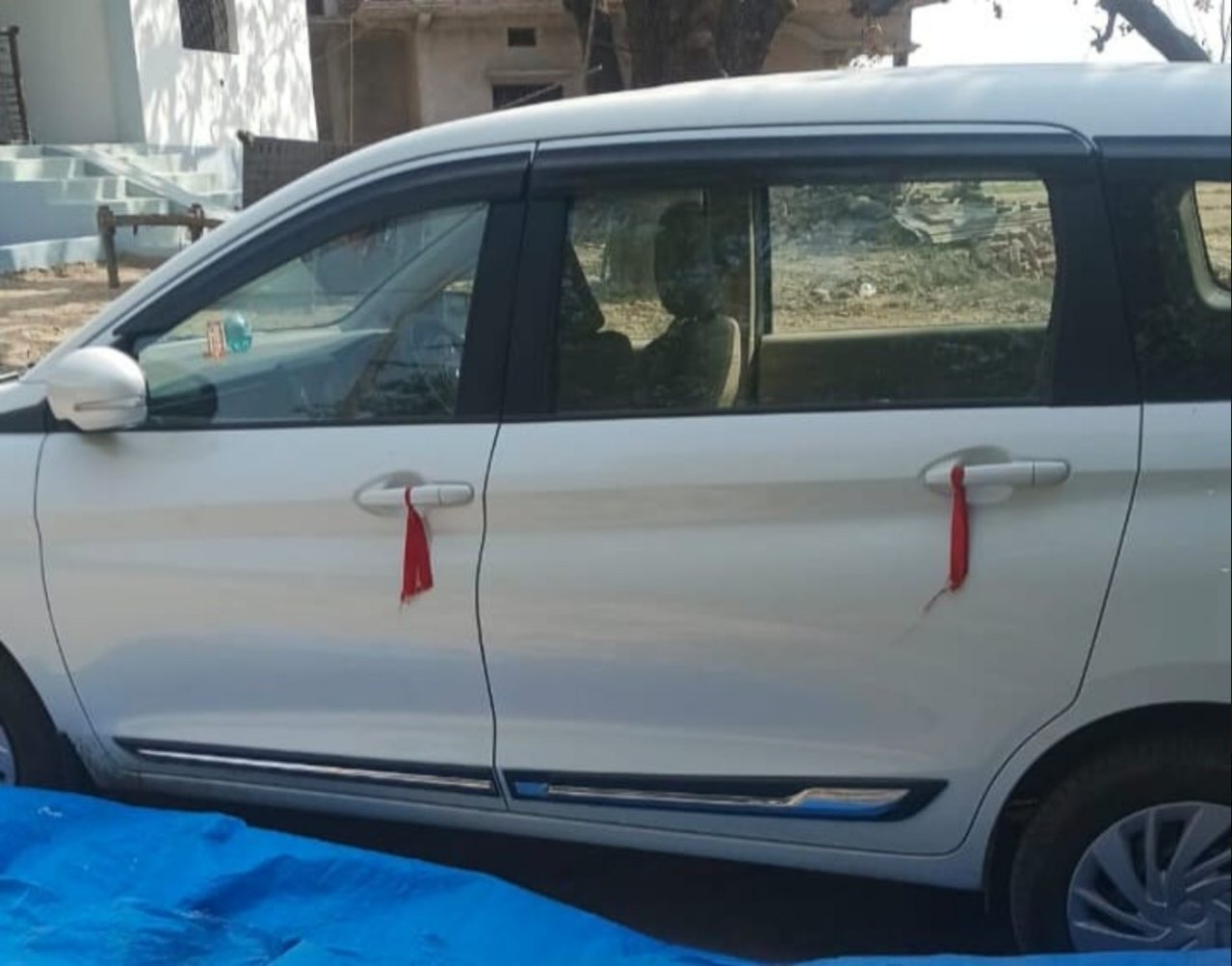 Actual white Ertiga side profile
