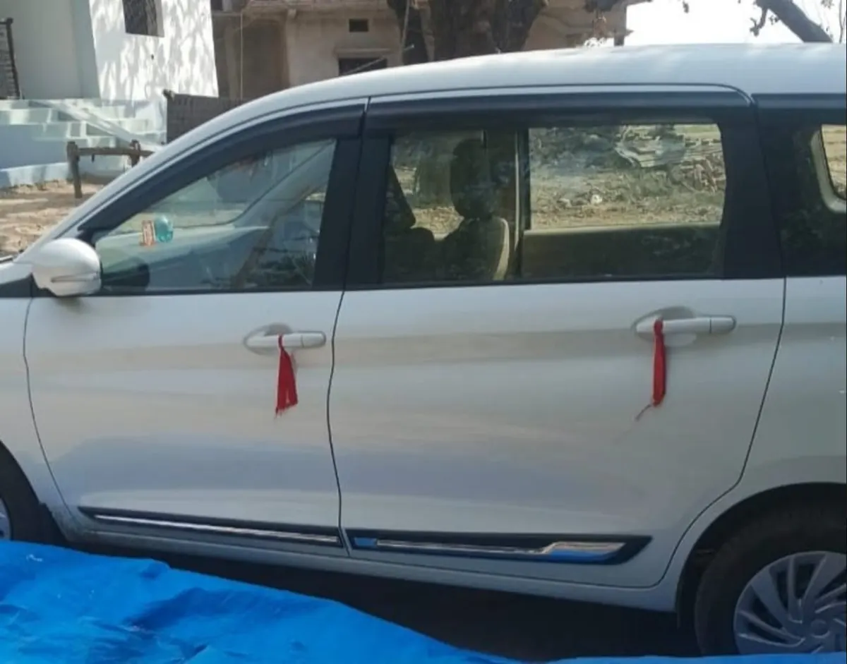 White Maruti Suzuki Ertiga used by Kashi Marg Yatra in Varanasi